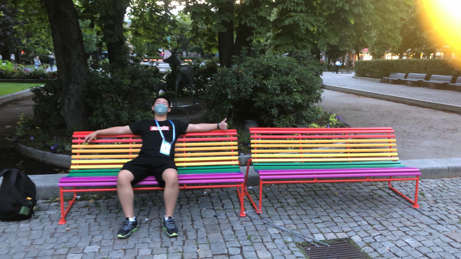 Eric on a rainbow bench